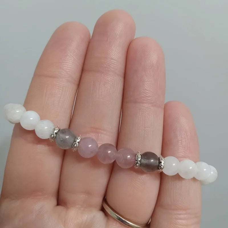 Elegant strand bracelet made of moonstone, rose quartz, and labradorite stones for healing and balance