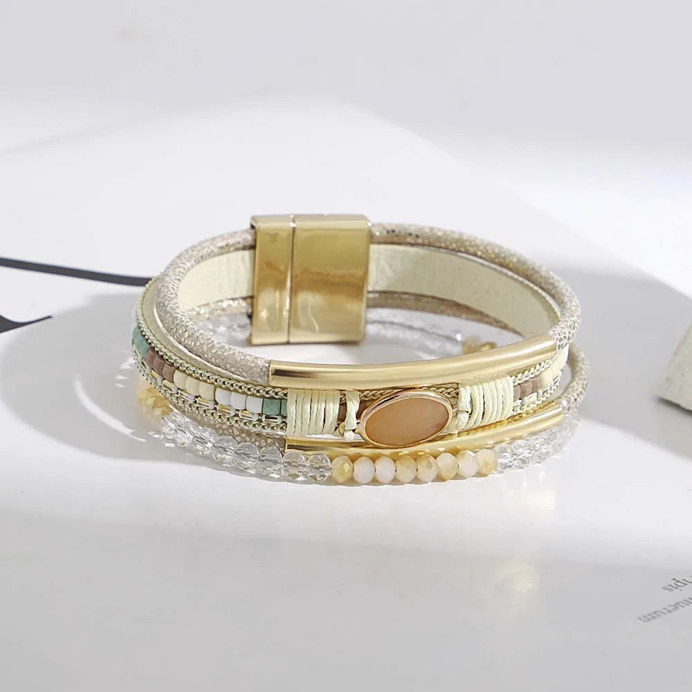 Flat lay of bohemian cuff bracelets in multiple colors
