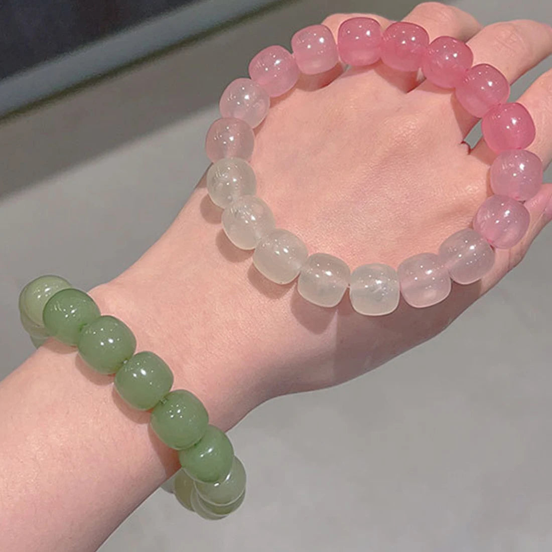 Fluorescent bead bracelet on a woman’s wrist