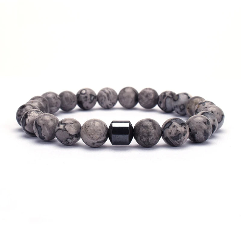 Hand modeling chakra bracelet with calm pose