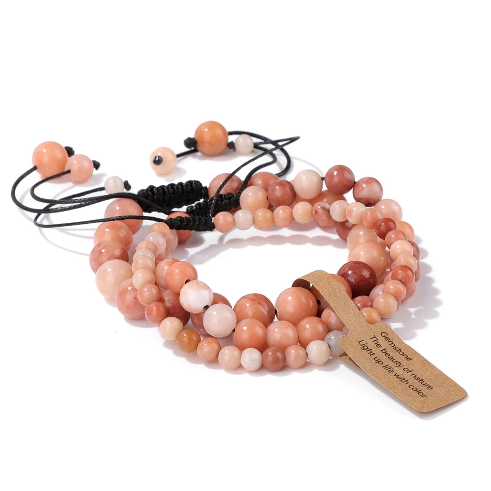 Hand wearing a natural stone bracelet