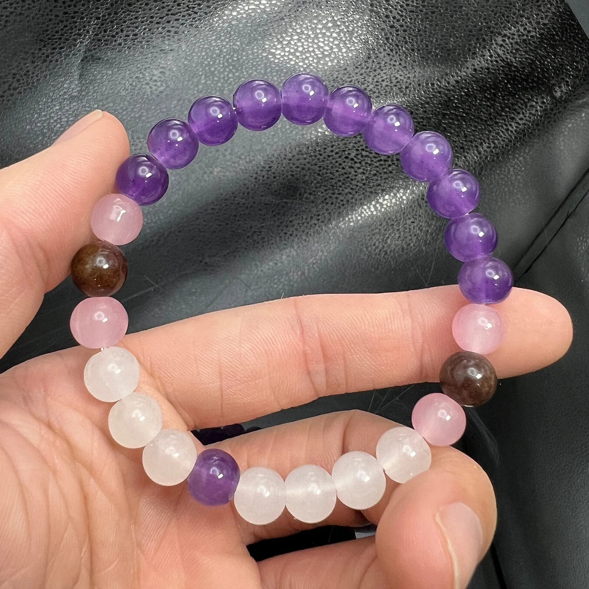 Lepidolite and Moonstone beaded bracelet on white background