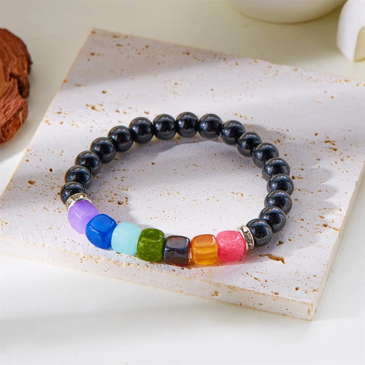 Multicolor chakra healing bracelets on hand