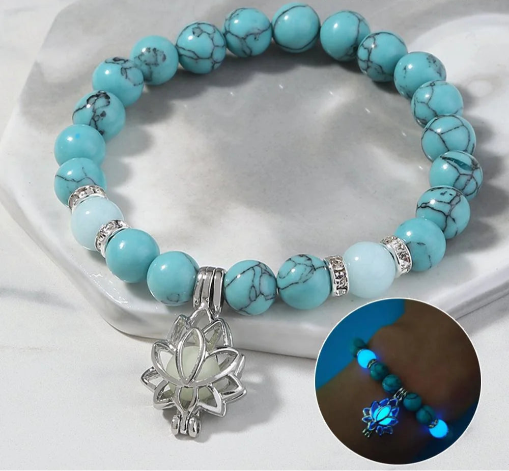 Natural stone bracelet with lotus charm on wrist