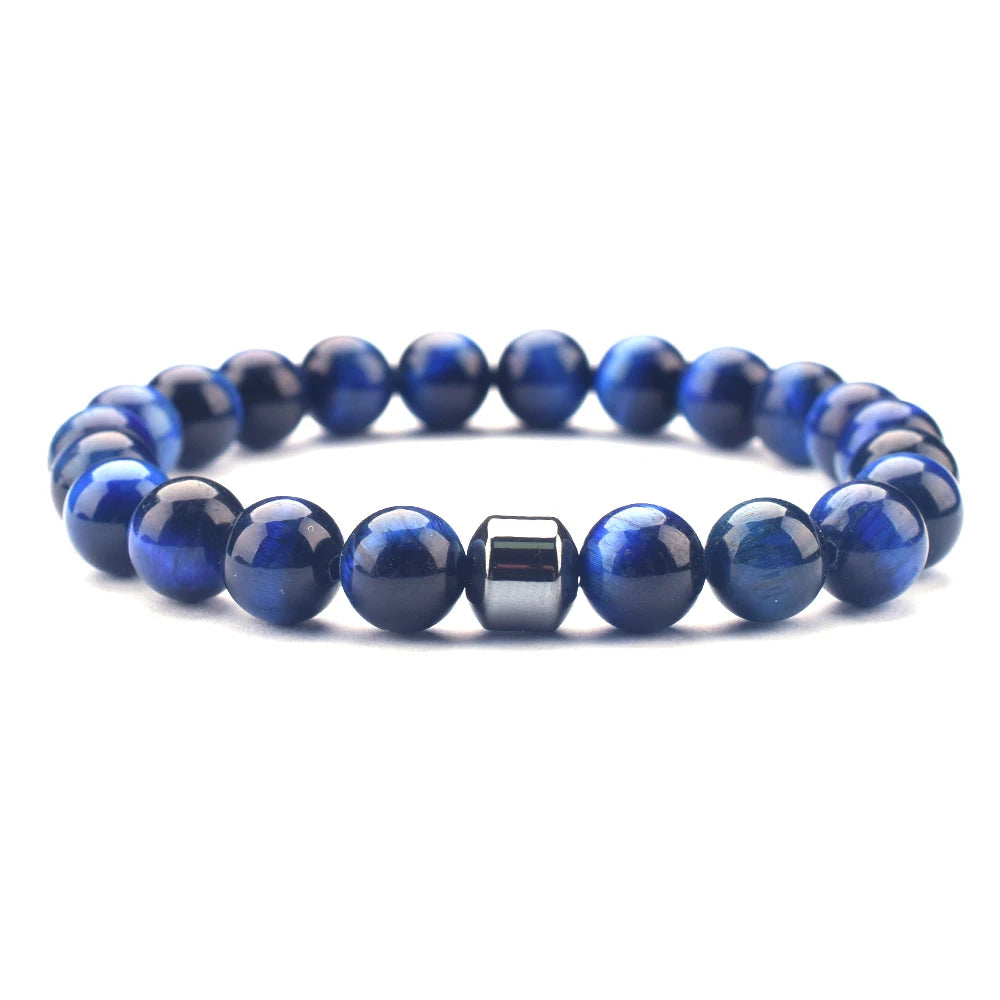 Raw gemstone bracelet on hand-carved wood dish