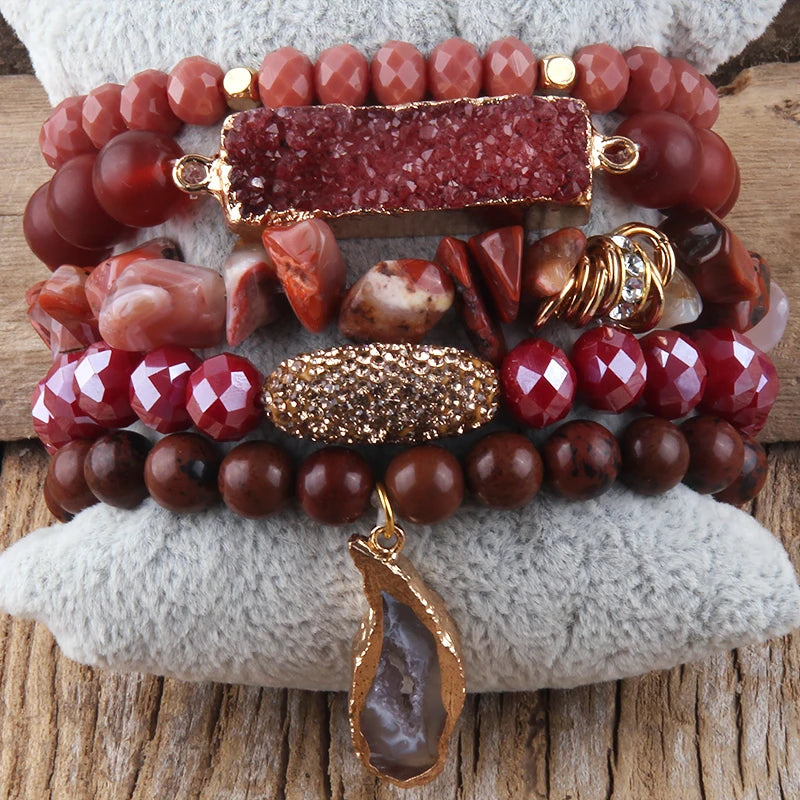 Red druzy charm bracelet set on neutral background