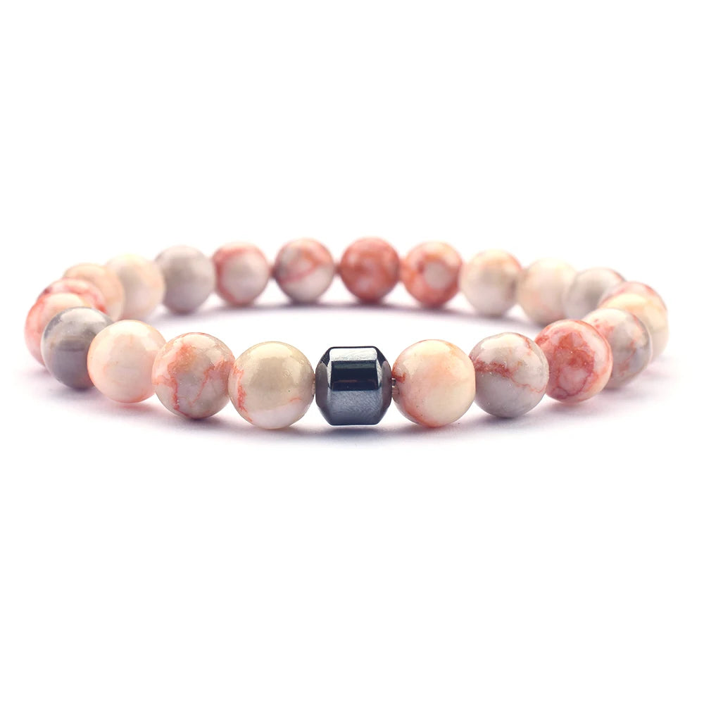 Stack of energy stone bracelets showing unique bead patterns