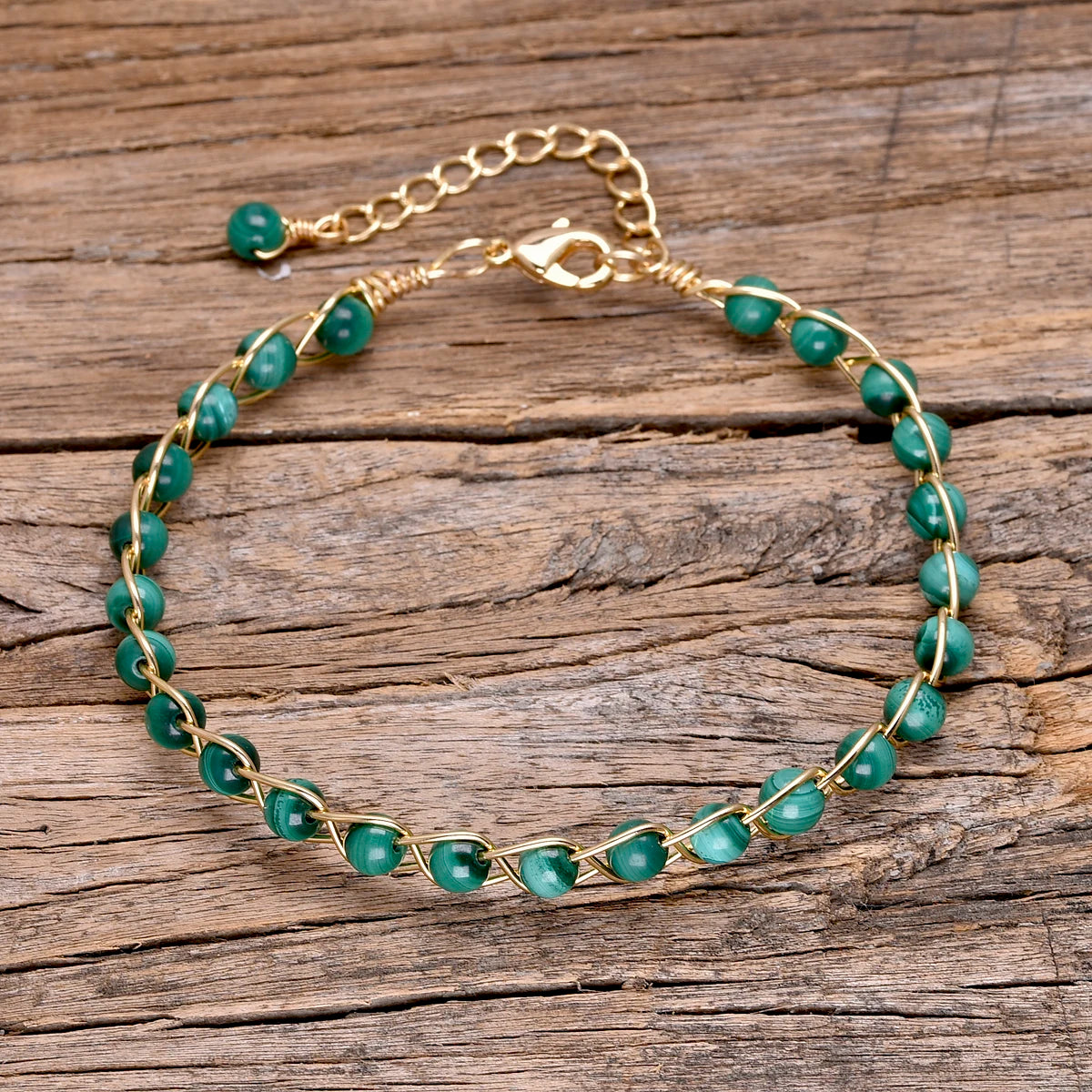 Woven copper bracelet featuring green malachite