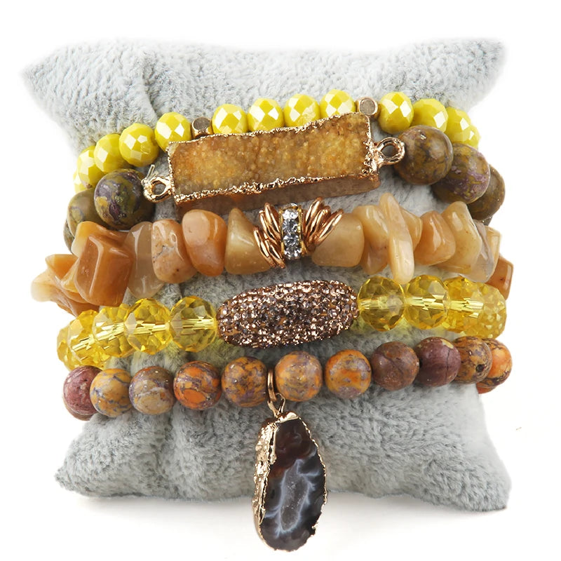 Yellow boho-style beaded bracelet set with gold accents