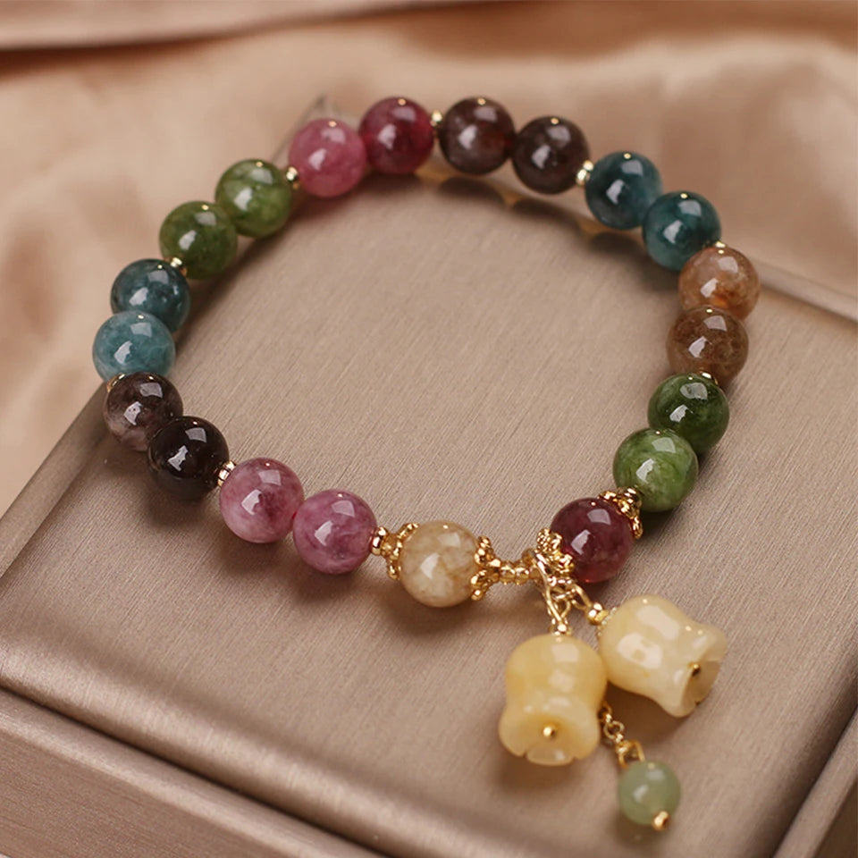 tourmaline and jade bracelet on white background