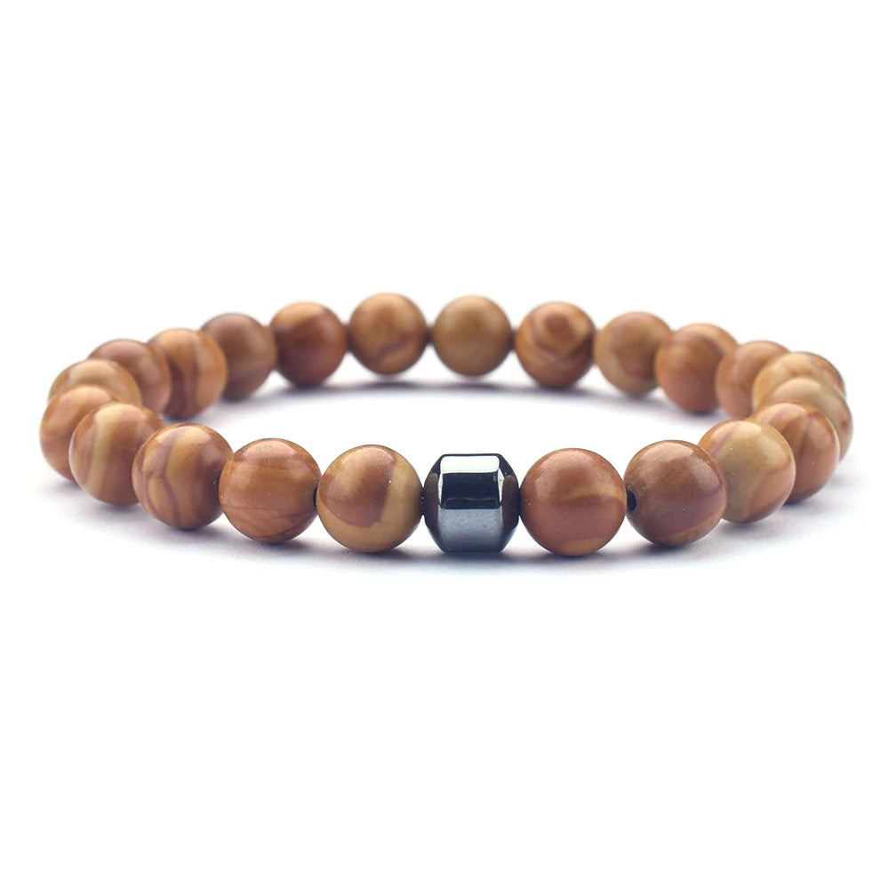 yellow wood grain love energy bracelet styled on wrist