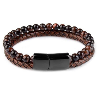 Artistic tiger eye stone bracelet laid on wooden surface