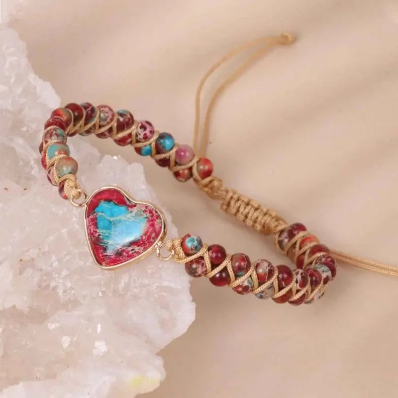 Close-up of heart charm center on stone bead bracelet