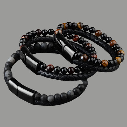 Close-up of lava stone and leather braided bracelet for men
