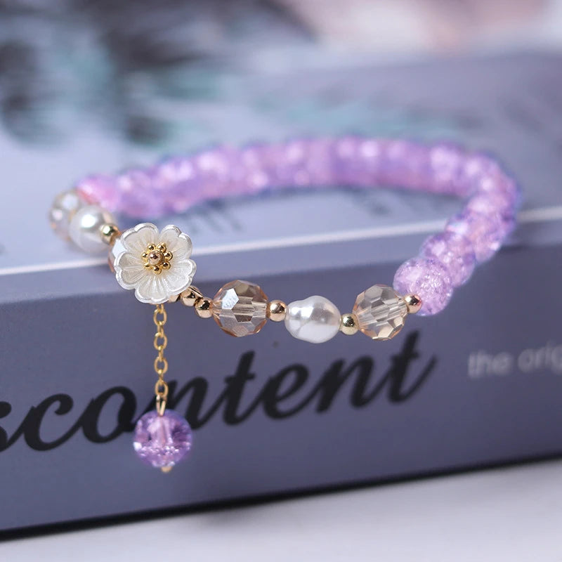 Elegant crystal beaded bracelet with flower charm and tassel