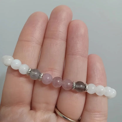 Elegant strand bracelet made of moonstone, rose quartz, and labradorite stones for healing and balance