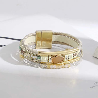 Flat lay of bohemian cuff bracelets in multiple colors