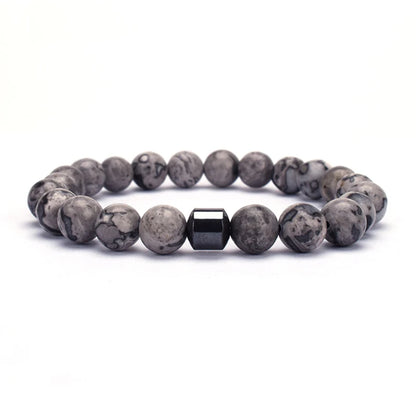 Hand modeling chakra bracelet with calm pose