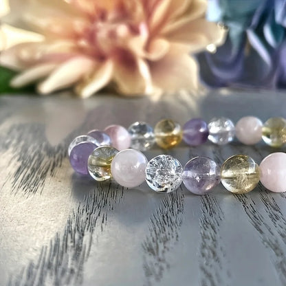 Stretch crystal bracelet featuring amethyst and clear quartz