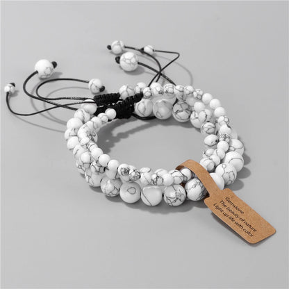 White and black marble beaded bracelet with glowing charm