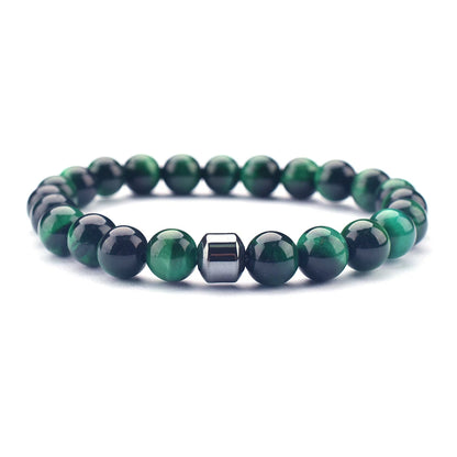 green tiger eye bracelet close-up on white linen