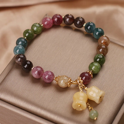 tourmaline and jade bracelet on white background